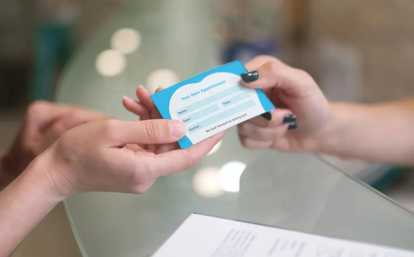 Two individuals engaged in a business card exchange, highlighting the importance of networking