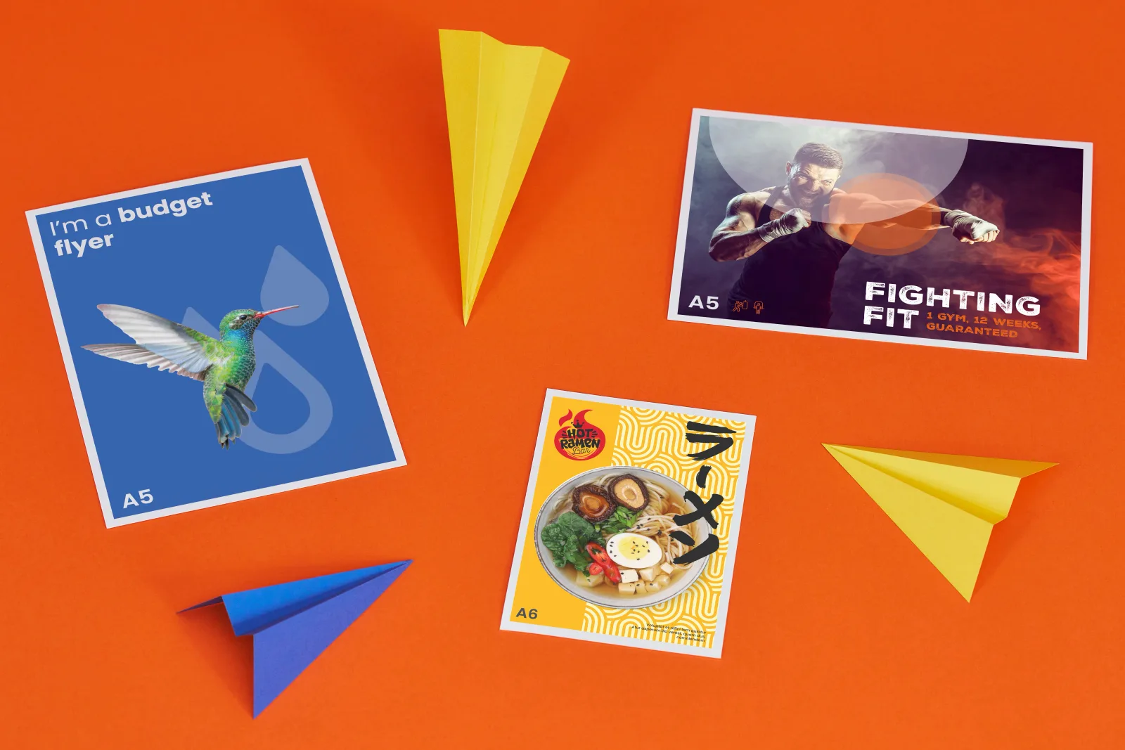 3 printed budget flyers, blue A5 portrait with hummingbird, A5 landscape with boxer and wording 'fighting fit' and a A6 portrait yellow flyer with a bowl of ramen on a bright orange backgrou