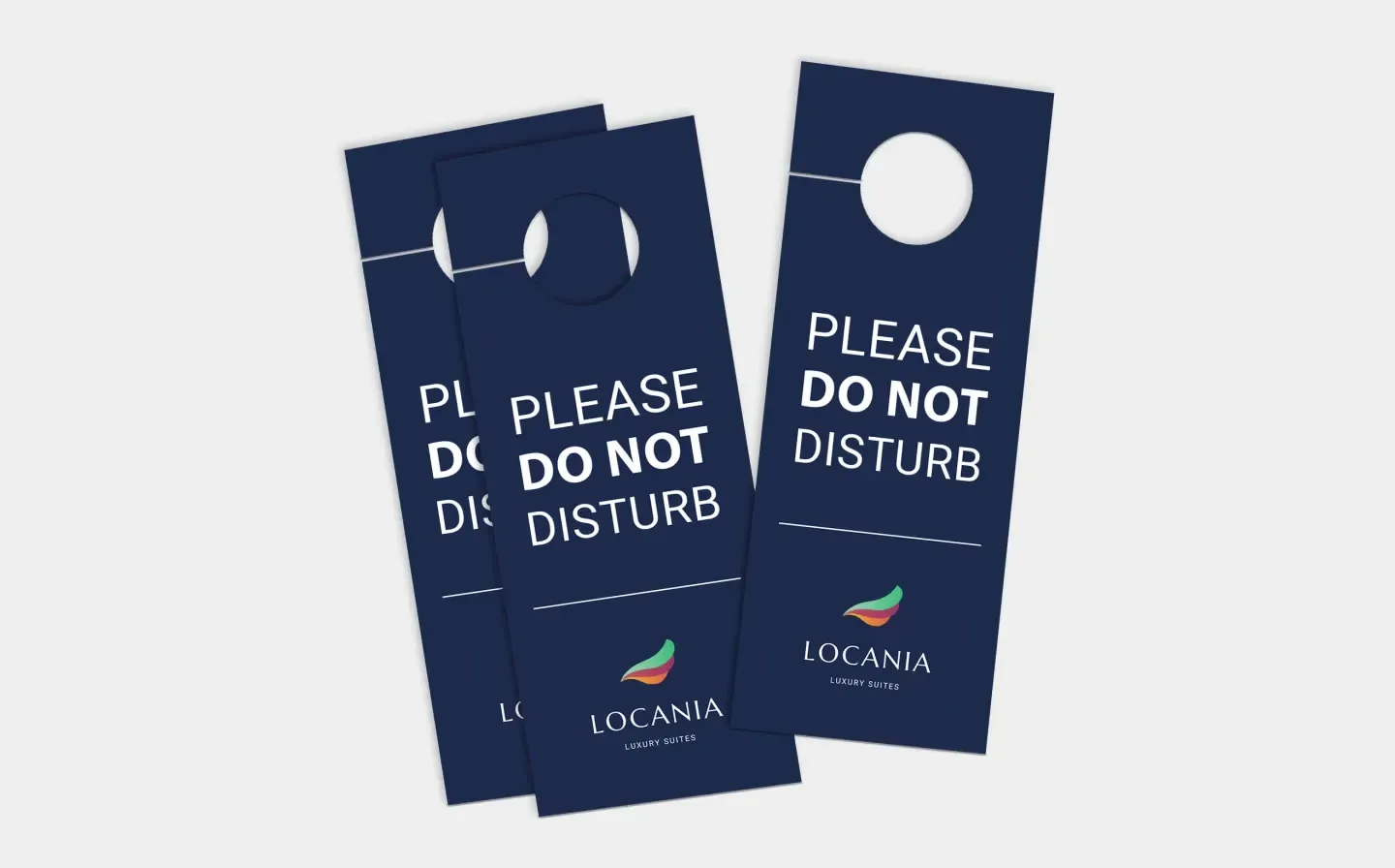 Three blue door hanger signs featuring the message "Please Do Not Disturb"