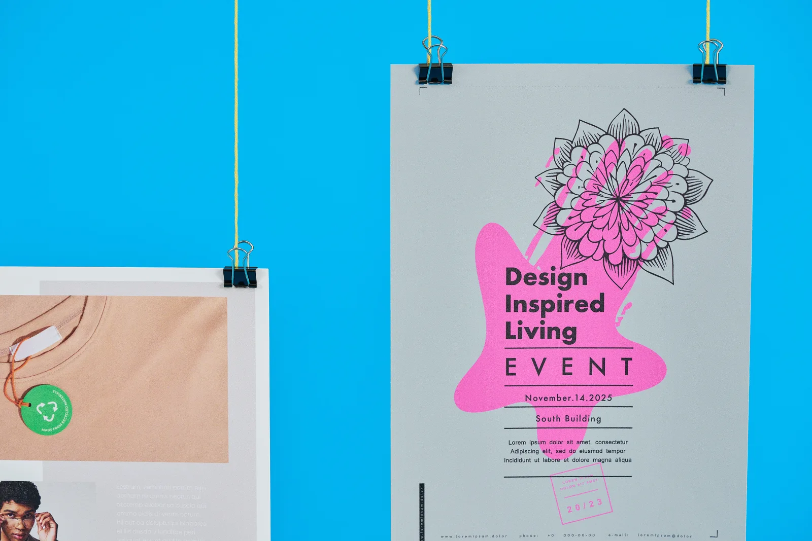 close up of a a4 portrait poster with text 'design inspired living event' hanging from yellow string on a bright blue background