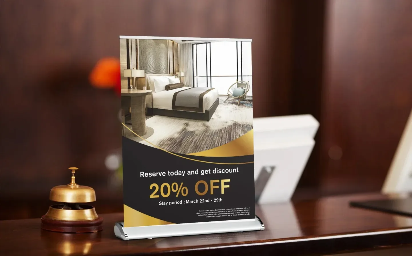  A hotel lobby featuring a desk with a desktop banner prominently displayed on it