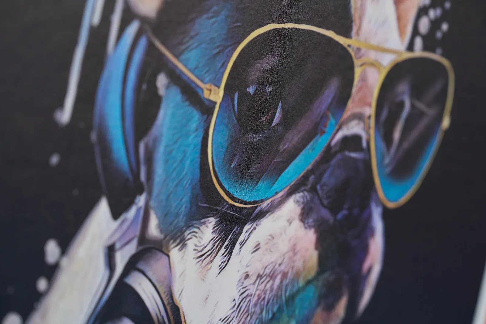close up of the print texture on a display board of a dog wearing sunglasses
