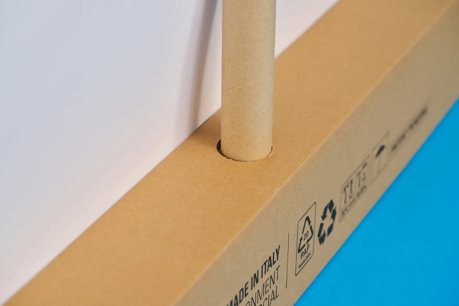 close up of the base and pole of a eco friendly roller banner on a bright blue background