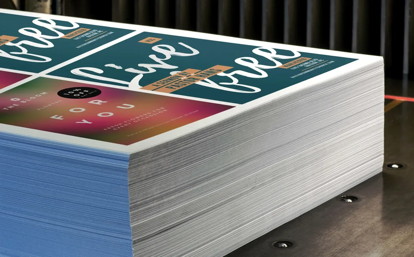 A neatly arranged stack of flat sheets on a flat surface, showcasing various designs and colours
