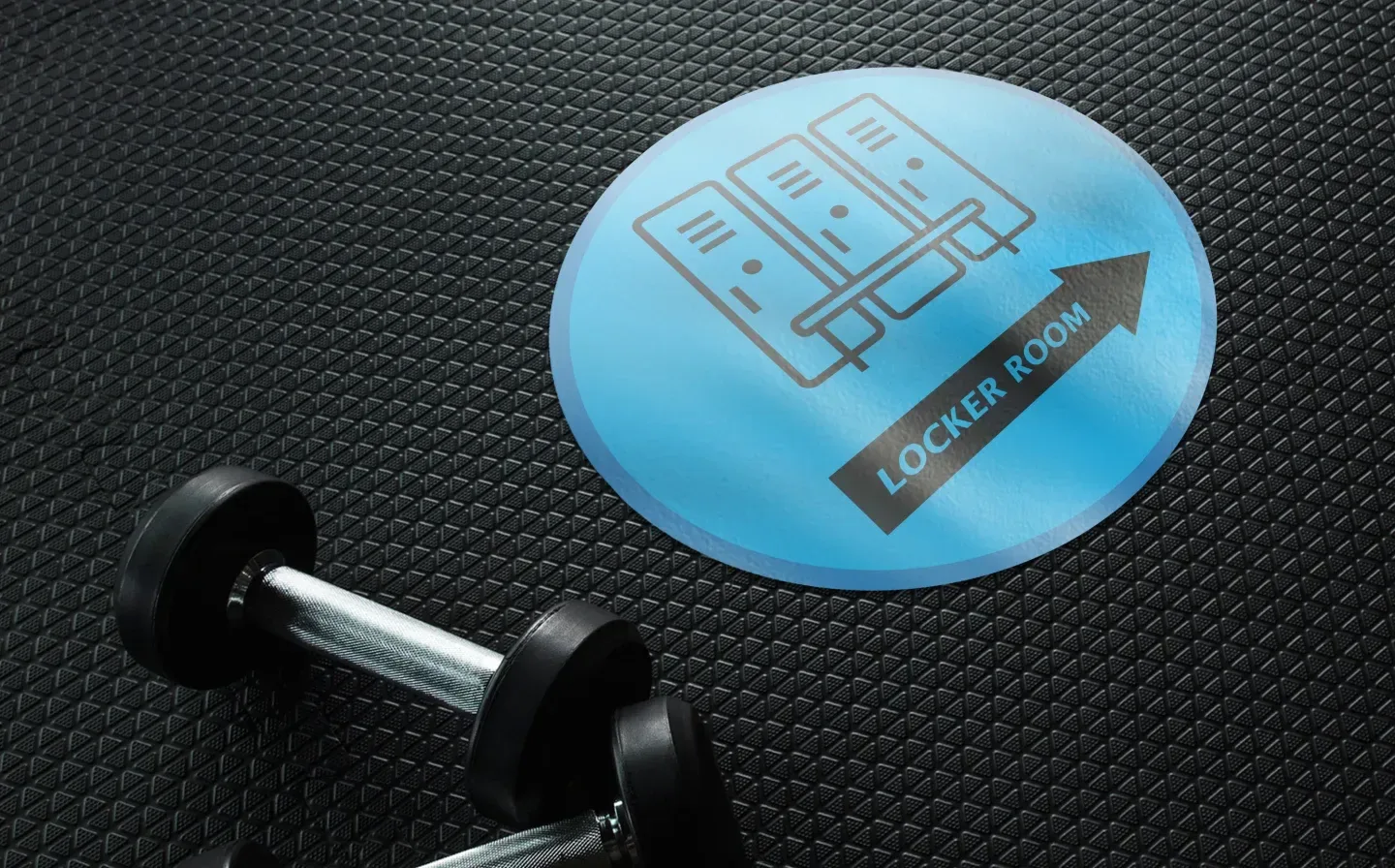 A blue floor sticker displaying the text "locker room" prominently for clear directional guidance