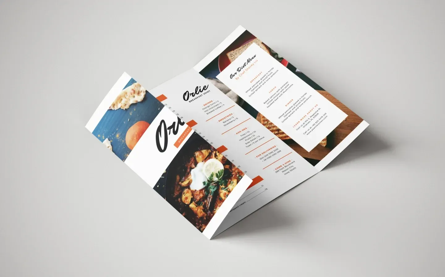A folded menu showcasing various dishes and drinks on a plain background