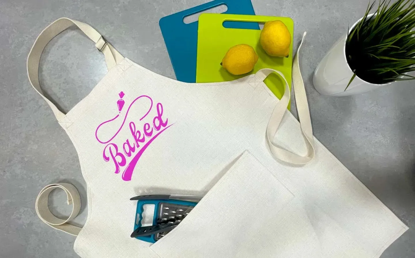 A top view of a kitchen counter featuring stylish apron adorned with a custom design