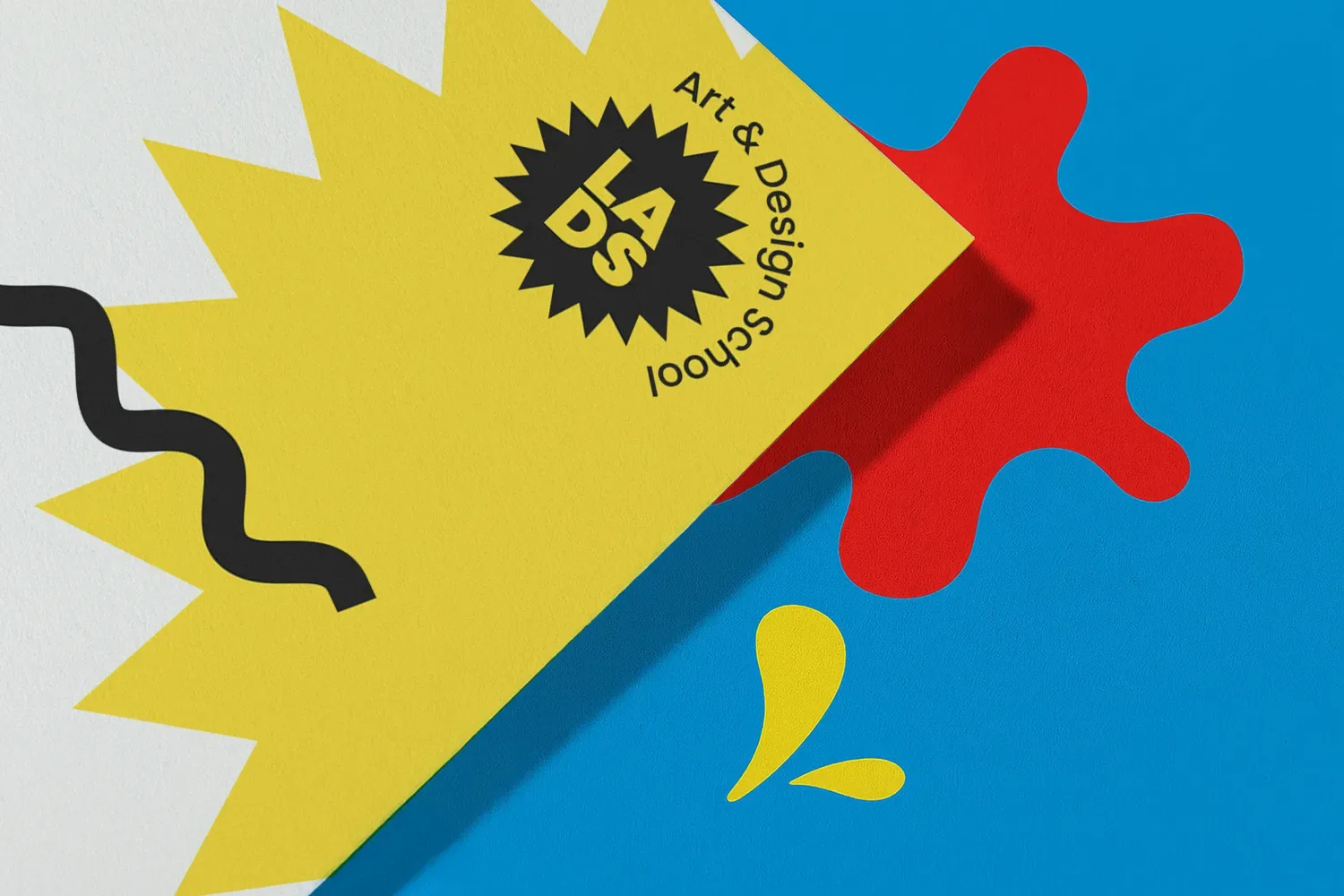 Yellow certificate with “Art & Design School” text on colourful abstract background.
