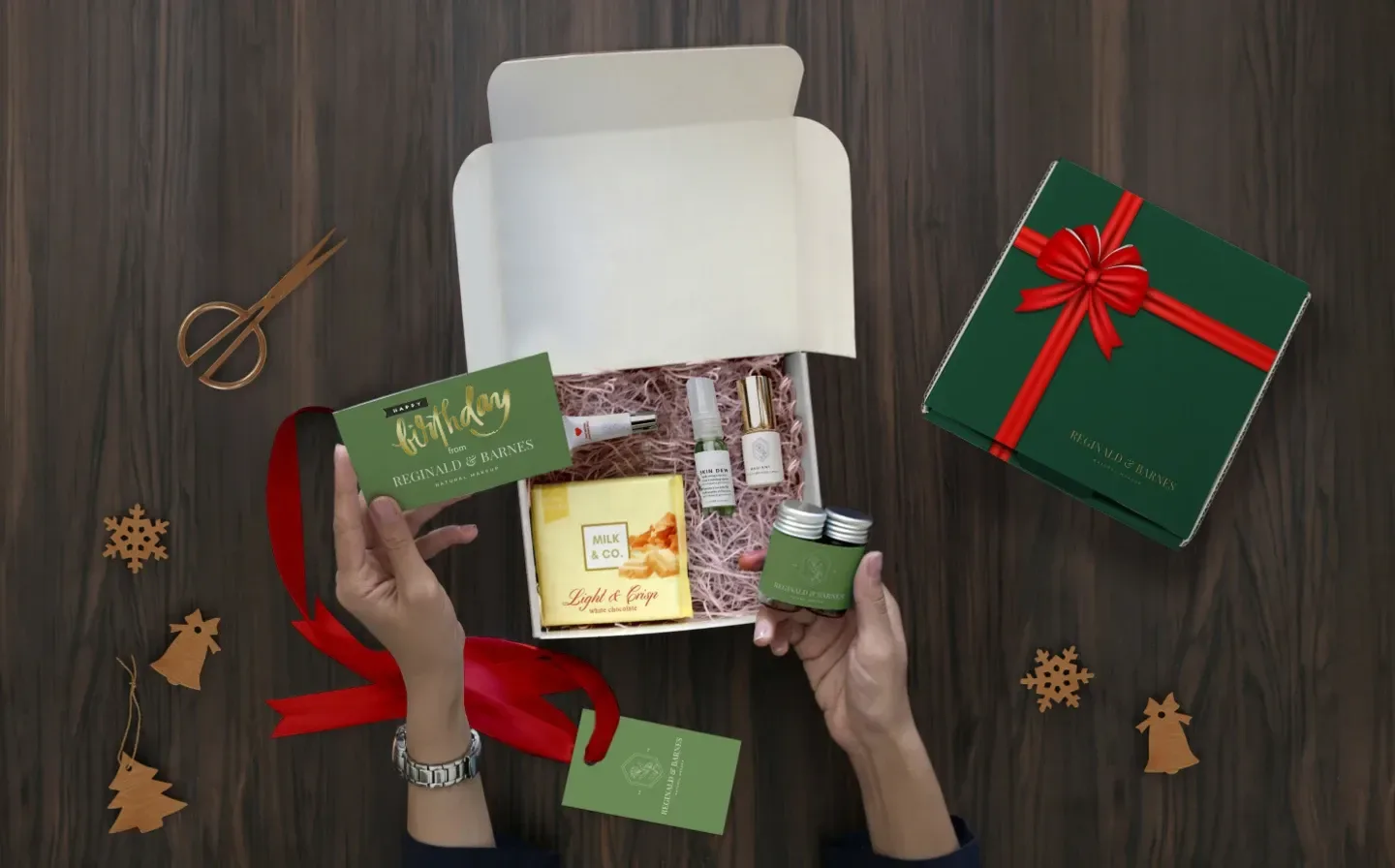 A woman opening a green birthday gift box alongside a gift card and more accessories