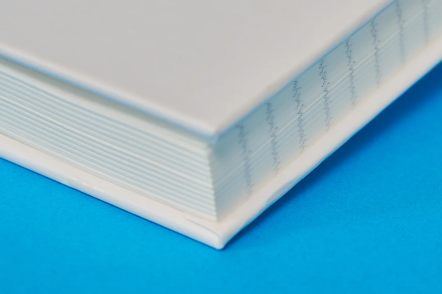 lined paper notebook detail on bright blue background
