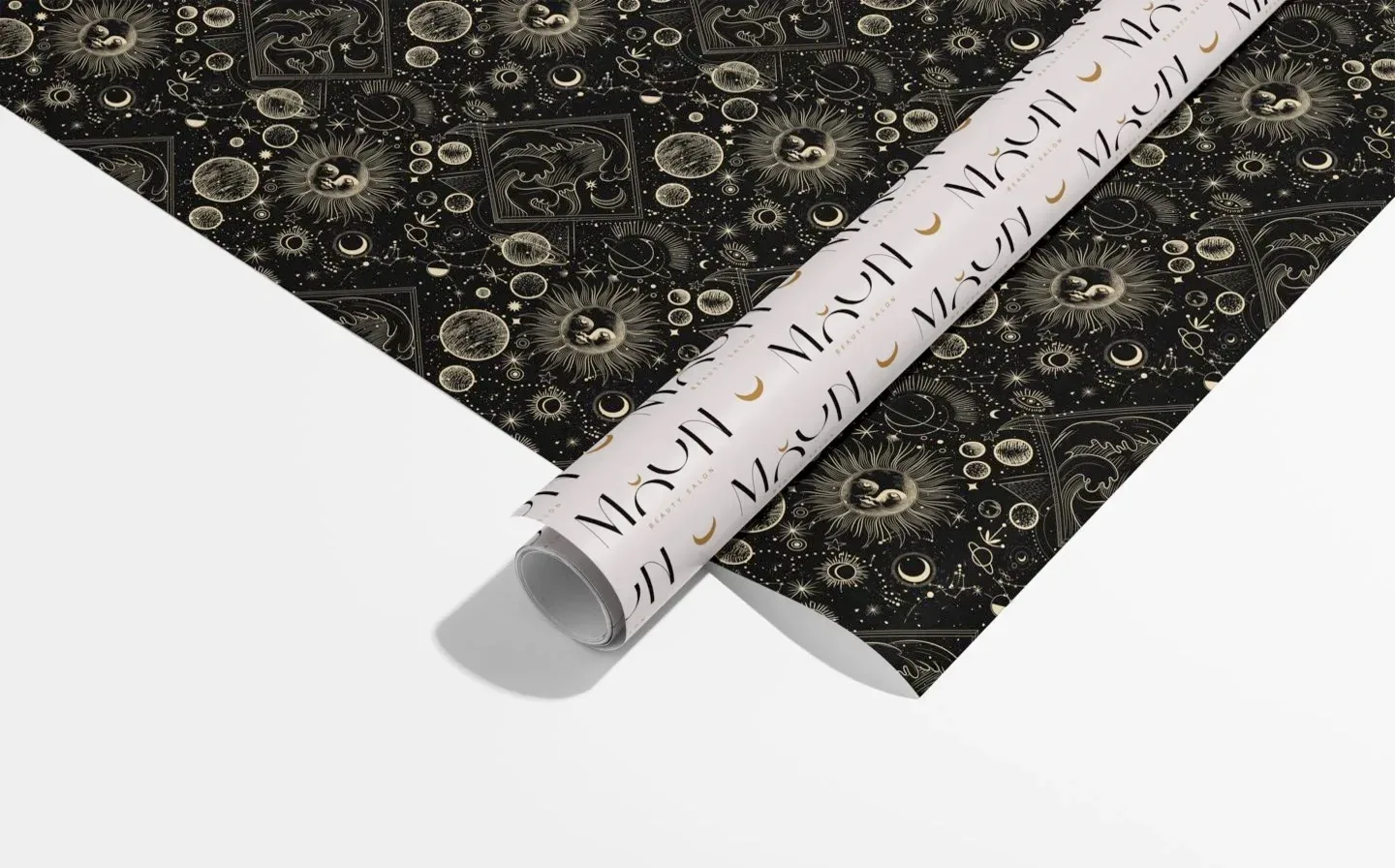 Wrapping paper rolls featuring a stylish black and white design displayed on a plain background