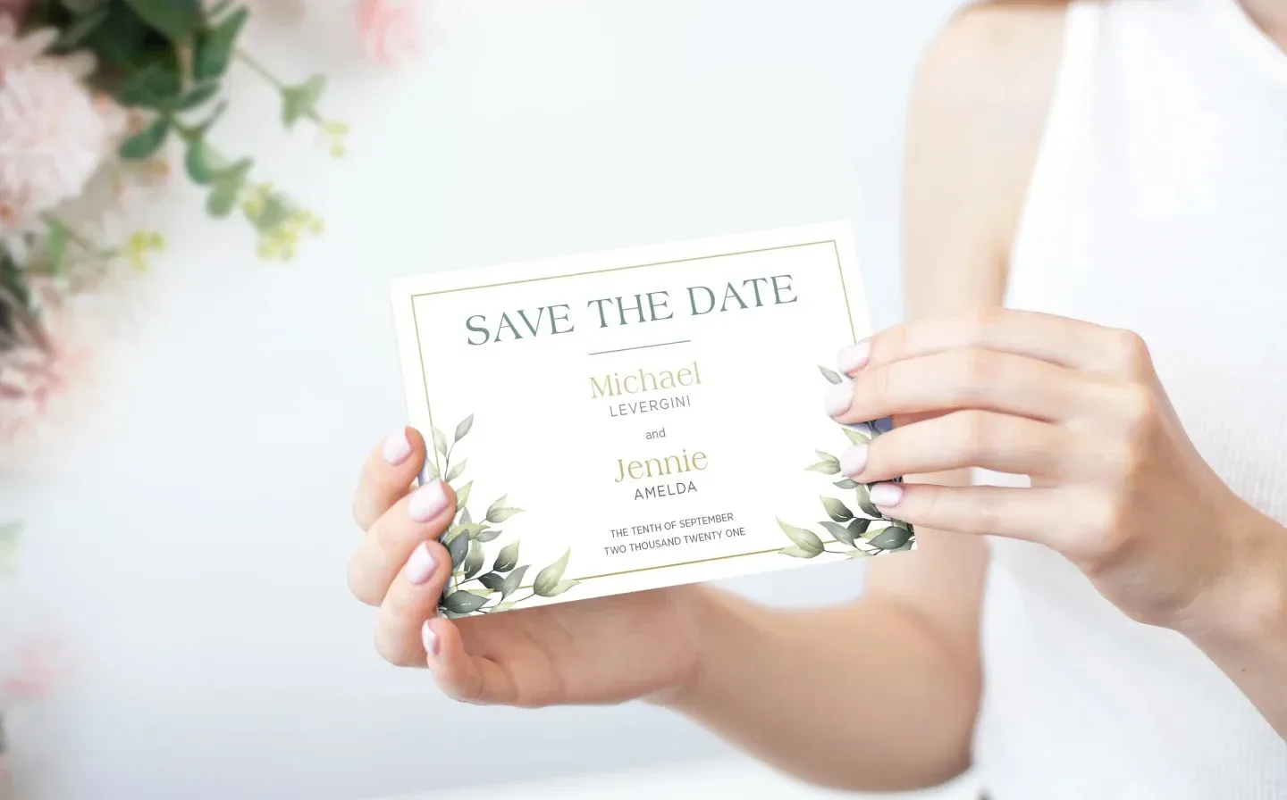 Elegantly designed wedding save the date card showcasing floral designs
