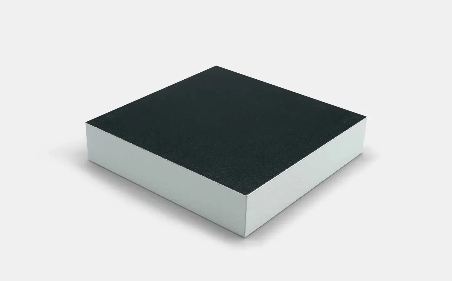 A photo block resting on a white surface, showcasing the back of a wooden photo block